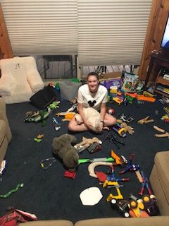 Me in my living room full of toys in the ground